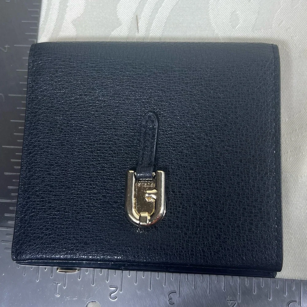 1017: Furla Black Pebbled Leather Compact Bifold Wallet